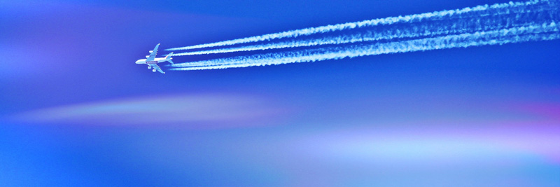 Plane in sky with jet stream